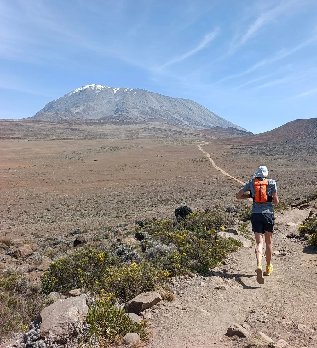 A climber moving fast on the upper slopes of Kilimanjaro